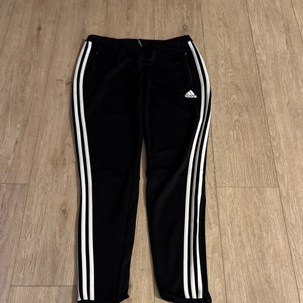 Adidas Black Track Pants with zipper bottom. Size M